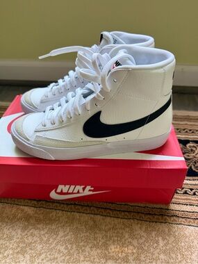 Nike White High-Top Sneakers with Black Swoosh